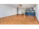 Spacious living area connecting to the kitchen, showcasing hardwood floors and ample natural light at 1221 Woodpecker Dr, Clover, SC 29710