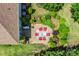 Aerial view showcases the backyard patio, professional landscaping, and outdoor kitchen area perfect for entertaining guests at 13204 Feale Ct, Charlotte, NC 28278