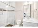 Well-lit bathroom with a glass-enclosed shower and white vanity, offering modern functionality at 13204 Feale Ct, Charlotte, NC 28278