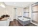 Luxurious bathroom with a soaking tub, glass shower, tiled floors, and granite vanity top at 13204 Feale Ct, Charlotte, NC 28278