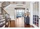 Grand foyer featuring hardwood floors, high ceilings, a staircase and an open view to the living room at 13204 Feale Ct, Charlotte, NC 28278