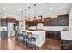 Gourmet kitchen with white countertops, a large island with seating, and stainless steel appliances at 13204 Feale Ct, Charlotte, NC 28278