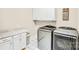 Laundry room featuring granite countertop, washing machine, and dryer at 13204 Feale Ct, Charlotte, NC 28278