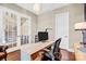 Bright home office space with hardwood floors, French doors, and neutral paint at 13204 Feale Ct, Charlotte, NC 28278