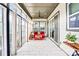 Comfortable sunroom with tiled floors, ceiling fan, and lots of natural light at 13204 Feale Ct, Charlotte, NC 28278