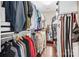 Spacious walk-in closet with clothing racks, shelves, and a full-length mirror for convenience at 13204 Feale Ct, Charlotte, NC 28278
