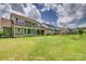 Expansive backyard view with multiple homes, patios, and lush green lawn highlighting outdoor living at 155 Boxelder Rd, Clover, SC 29710