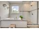 Bright bathroom features a soaking tub and a separate shower with a glass door at 155 Boxelder Rd, Clover, SC 29710