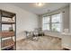 Bright bedroom with neutral carpet, large window, white trim, and simple furnishings at 155 Boxelder Rd, Clover, SC 29710