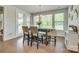 Bright dining area with large windows, a rustic wood table, and stylish seating at 155 Boxelder Rd, Clover, SC 29710