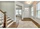 Bright foyer features hardwood floors, a staircase, and a view into the adjacent living area at 155 Boxelder Rd, Clover, SC 29710