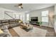 Comfortable living room with hardwood floors, a plush sofa, and a modern entertainment center at 155 Boxelder Rd, Clover, SC 29710