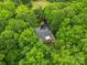 An aerial view of a secluded home surrounded by a dense, vibrant forest at 1669 Mary Ellen Dr, Fort Mill, SC 29708