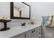 Updated bathroom with stone countertop, vanity with storage, a modern mirror and decorative accessories at 1669 Mary Ellen Dr, Fort Mill, SC 29708