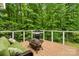 Inviting outdoor deck with a grill, comfortable seating, and scenic views of the lush greenery at 1669 Mary Ellen Dr, Fort Mill, SC 29708