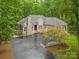 Charming home with stone accents, lush landscaping, and a spacious driveway at 1669 Mary Ellen Dr, Fort Mill, SC 29708