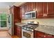 Gourmet kitchen with stainless steel appliances including a refrigerator, stove, oven, and microwave at 1669 Mary Ellen Dr, Fort Mill, SC 29708