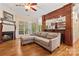 Cozy living room with hardwood floors, fireplace, and ample natural light at 1669 Mary Ellen Dr, Fort Mill, SC 29708