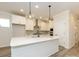 Open kitchen featuring a large island, stainless appliances, and modern lighting fixtures at 17033 Malone Ln, Mint Hill, NC 28227
