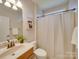 Cozy bathroom featuring a shower with a framed art piece hanging on the wall at 1708 Aringill Ln, Matthews, NC 28104
