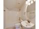 Bright bathroom features a shower and tub combination with bronze fixtures and a white sink and toilet at 1708 Aringill Ln, Matthews, NC 28104
