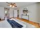 Bright bedroom featuring hardwood floors, stylish decor, and a comfortable, inviting atmosphere at 1708 Aringill Ln, Matthews, NC 28104