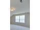This bedroom features neutral paint, carpet, and a double window for lots of natural light at 1708 Aringill Ln, Matthews, NC 28104