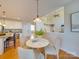 Eat-in kitchen/dining area featuring a breakfast nook and light hardwood flooring throughout at 1708 Aringill Ln, Matthews, NC 28104