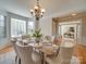 Formal dining room boasts a bay window for natural light and views of the front yard at 1708 Aringill Ln, Matthews, NC 28104