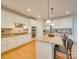 Bright kitchen with white cabinets, granite countertops, stainless steel appliances, and island at 1708 Aringill Ln, Matthews, NC 28104