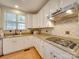 Well-lit kitchen featuring granite countertops, a stainless range hood, and tile backsplash at 1708 Aringill Ln, Matthews, NC 28104