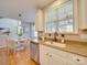 Eat-in kitchen features granite countertops, stainless steel appliances, and lots of natural light at 1708 Aringill Ln, Matthews, NC 28104