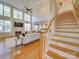Spacious living room featuring a fireplace, large windows, and an open floor plan at 1708 Aringill Ln, Matthews, NC 28104