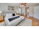 Main bedroom featuring a ceiling fan, neutral color palette, and ample natural light at 1708 Aringill Ln, Matthews, NC 28104