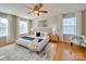 Bright main bedroom features a ceiling fan, area rug, and a serene atmosphere at 1708 Aringill Ln, Matthews, NC 28104