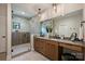 Modern bathroom with double vanity, modern fixtures, walk-in shower with glass doors at 1711 Summey Ave, Charlotte, NC 28205