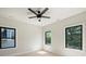 Bright bedroom with a ceiling fan and large black-trimmed windows for natural light at 1711 Summey Ave, Charlotte, NC 28205