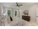 Bright bedroom with neutral paint and decor, natural light and modern ceiling fan at 1711 Summey Ave, Charlotte, NC 28205