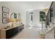 Inviting entryway with modern furnishings, a decorative mirror, and ample natural light creating a grand entrance at 1711 Summey Ave, Charlotte, NC 28205