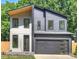 Modern two-story home featuring a two-car garage, contemporary design, and neutral color palette at 1711 Summey Ave, Charlotte, NC 28205