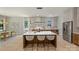 Open kitchen boasts a large island with seating, modern lighting, and stainless steel appliances at 1711 Summey Ave, Charlotte, NC 28205