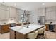 Bright kitchen features a large island with bar seating, stainless steel appliances, and modern fixtures at 1711 Summey Ave, Charlotte, NC 28205