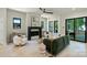 Bright living room with black window frames, neutral paint, and lots of natural light at 1711 Summey Ave, Charlotte, NC 28205
