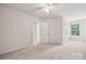 Spacious bedroom with plush carpet and a window that provides natural light at 17916 Ragtop Day Ln, Cornelius, NC 28031
