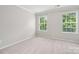 Clean and bright bedroom with plush carpeting and bright natural light at 17916 Ragtop Day Ln, Cornelius, NC 28031