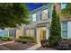 Traditional brick facade complemented by blue shutters and mature landscaping at 17916 Ragtop Day Ln, Cornelius, NC 28031