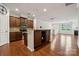 Open kitchen with stainless steel appliances and granite countertops at 17916 Ragtop Day Ln, Cornelius, NC 28031