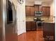 Beautiful kitchen features stainless appliances, ample cabinet storage, and gleaming hardwood floors at 17916 Ragtop Day Ln, Cornelius, NC 28031
