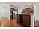 Beautiful kitchen with dark cabinetry, stainless appliances, and a central island at 17916 Ragtop Day Ln, Cornelius, NC 28031