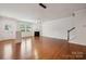 Spacious living room featuring a fireplace and plenty of natural light at 17916 Ragtop Day Ln, Cornelius, NC 28031